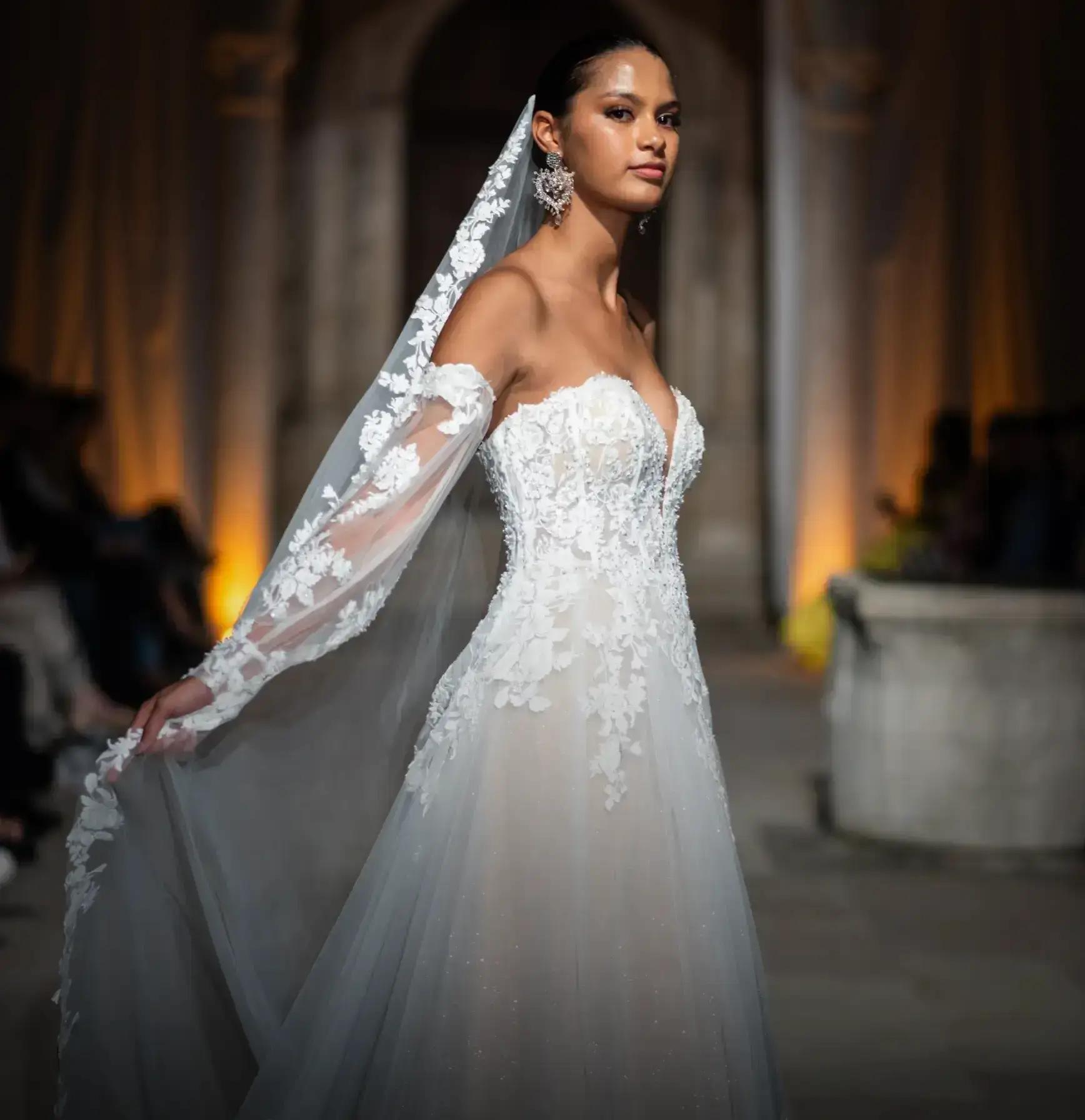 Models wearing a gown by Randy Fenoli