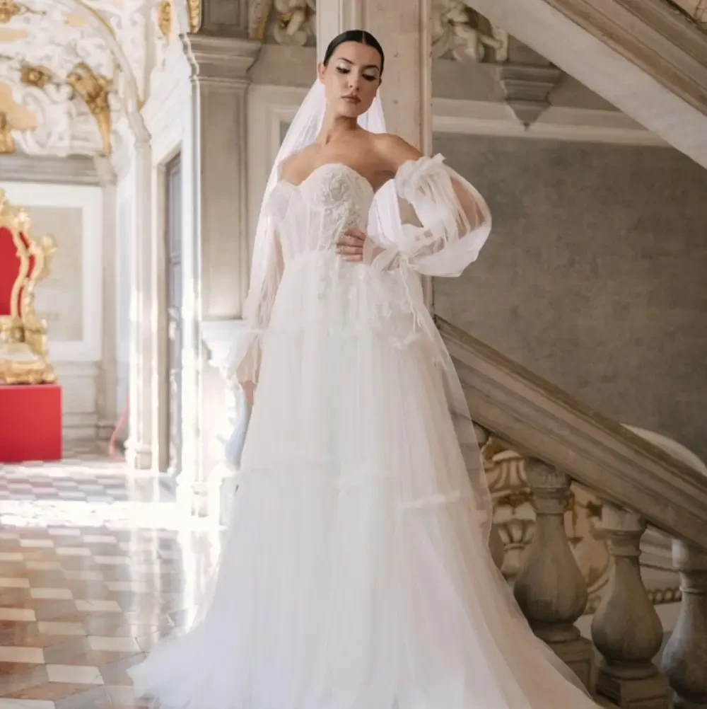 Models wearing a gown by Clementina